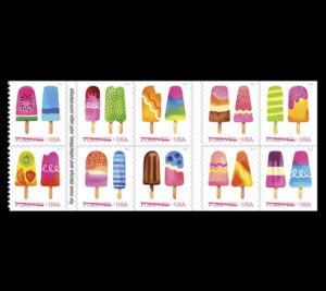 Multicolored popsicles on white background
