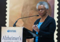 Female doctor stands at podium