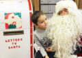 Little boy with Santa and mailbox