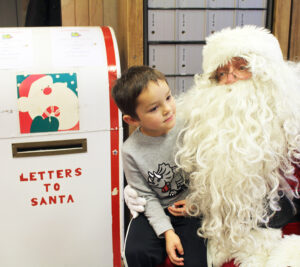 Little boy with Santa and mailbox