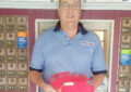 Man holds fanned out envelopes