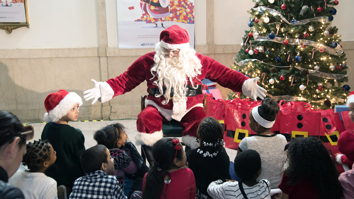 Santa Claus greet children