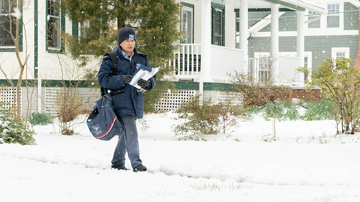 Arlington, VA, Letter Carrier Andy Lac delivers in winter weather