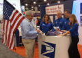 People talk at trade show booth