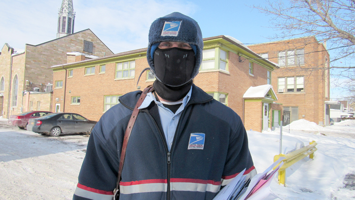 Buffalo, NY, Letter Carrier Shane Pierren dons protective winter gear