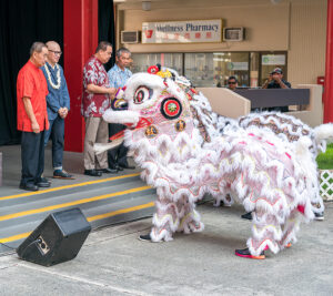 Performers dressed as lions greet the ceremony participants.