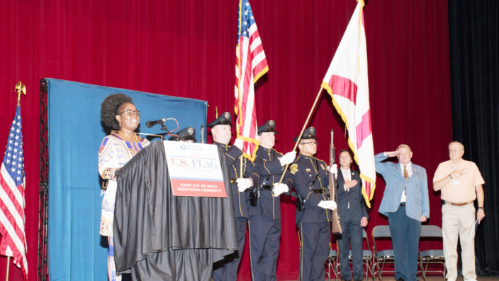 Woman speaks at podium