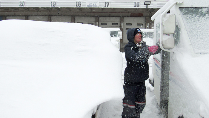 person scraping ice