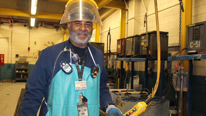 Maintenance Mechanic Anthony Lattimer holds equipment