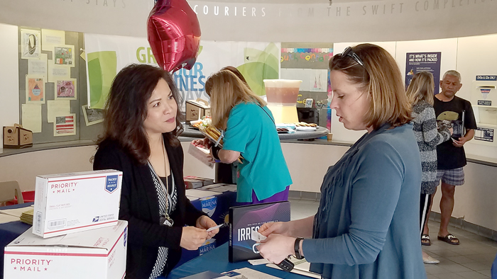 Woman talks to retail clerk