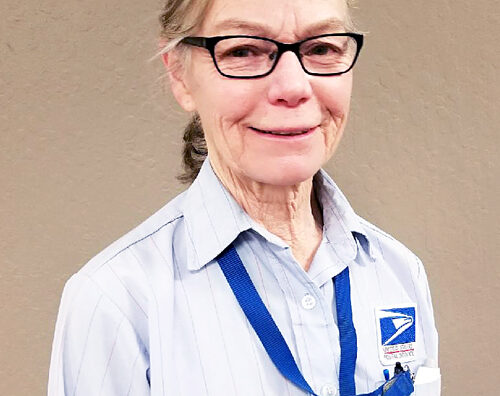 Postal worker smiles