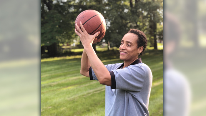 Employee holds basketball