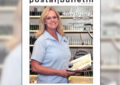 Smiling postal worker on Postal Bulletin cover