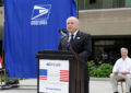 Man speaks at podium