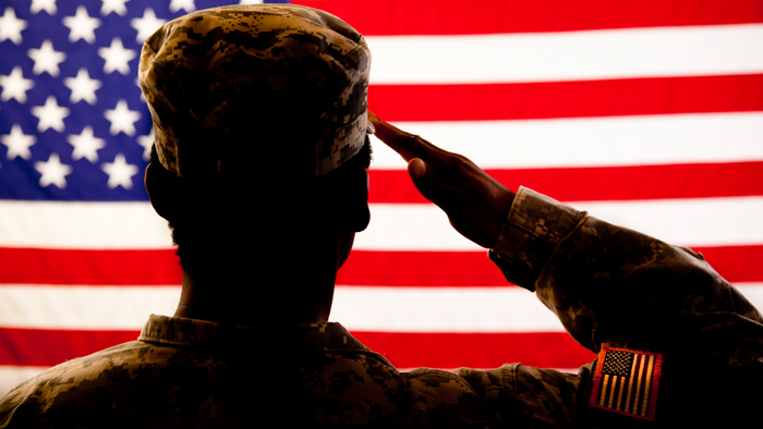 Soldier saluting the U.S. flag
