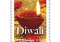 Stamp showing lit candle