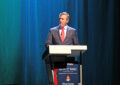 Jeff Williamson speaks at stamp ceremony