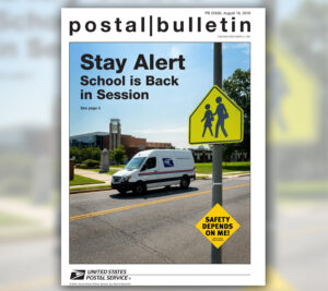 Magazine cover that shows postal truck on street near school traffic sign