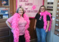 Postal employees dressed in pink