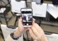 Woman's hands hold smartphone