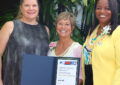 Three women with award