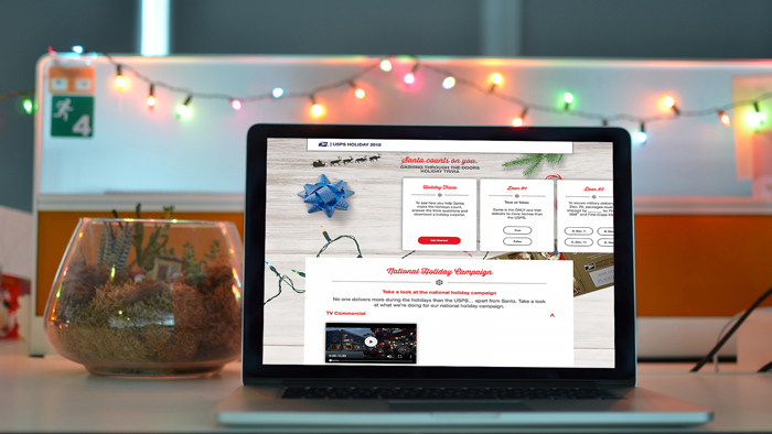 Laptop computer showing USPS Holiday 2018 website