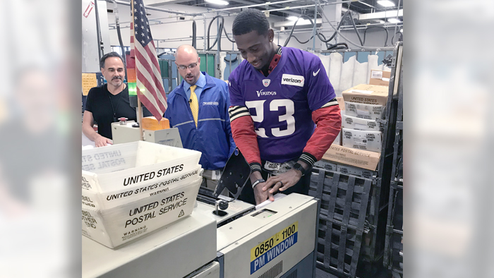 Minnesota Vikings football player visits Postal Service processing center