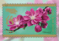 Stamp showing purple flowers on a branch