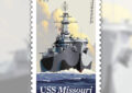 Stamp showing battleship in water