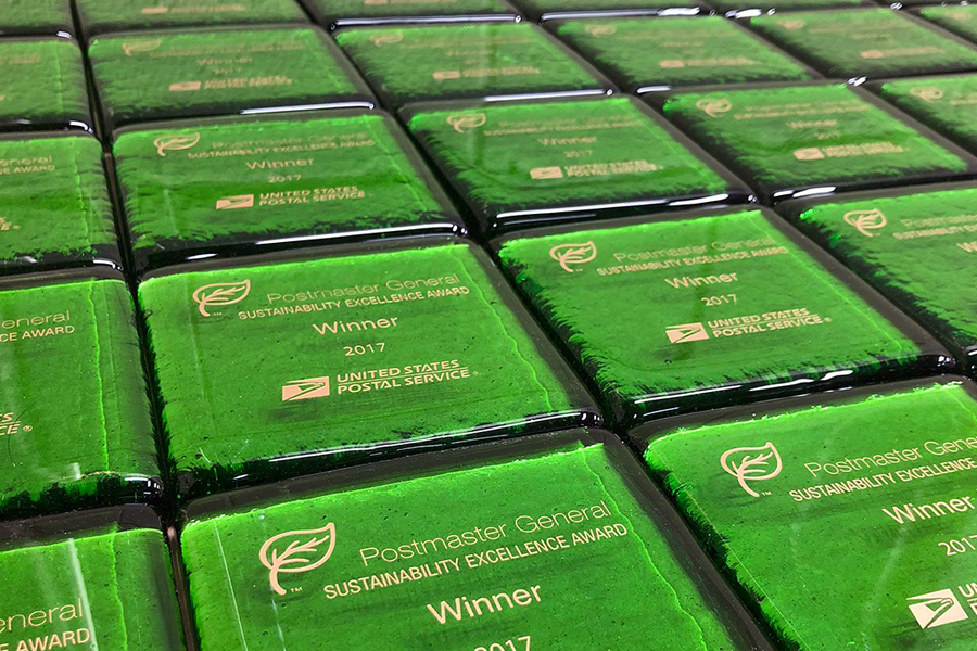 Postmaster General Sustainability Excellence Award paperweights