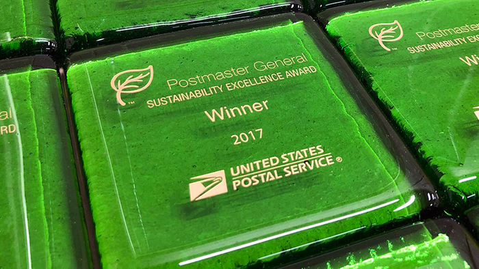 Postmaster General Sustainability Excellence Award paperweights
