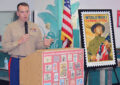 Man in Marine uniform speaks at podium