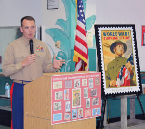 Man in Marine uniform speaks at podium