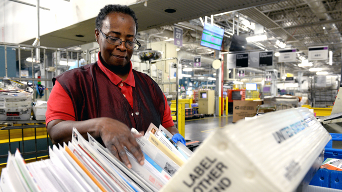 Ivy Briscoe, a mail processing clerk, works at the Suburban Maryland Processing and Distribution Center