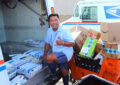 Sam Sarmiento, a letter carrier at Hillcrest Station in San Diego, loads a delivery vehicle