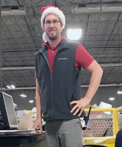 Jonathan McIntosh, a distribution operations acting supervisor at the Orlando, FL, Seminole Processing and Distribution Center, dons a holiday hat.