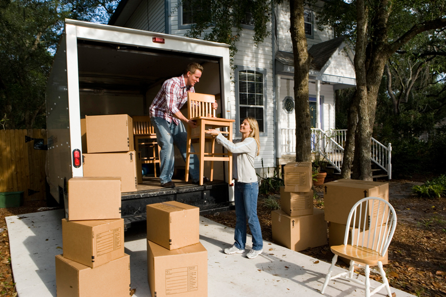 Man and woman loading a moving van