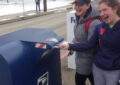 Two students mailing letters