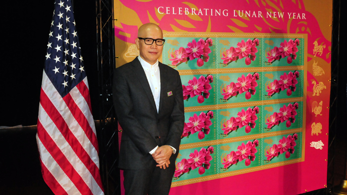 Kam Mak, the artist who created the Year of the Boar stamp artwork