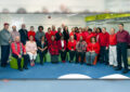 Large group of people wearing red