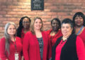 Six women wear red