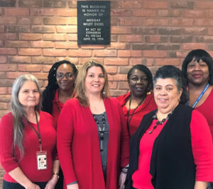 Six women wear red