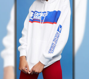 Model wearing white hoodie with USPS logo