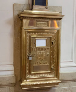 Lobby mailbox connected to chute