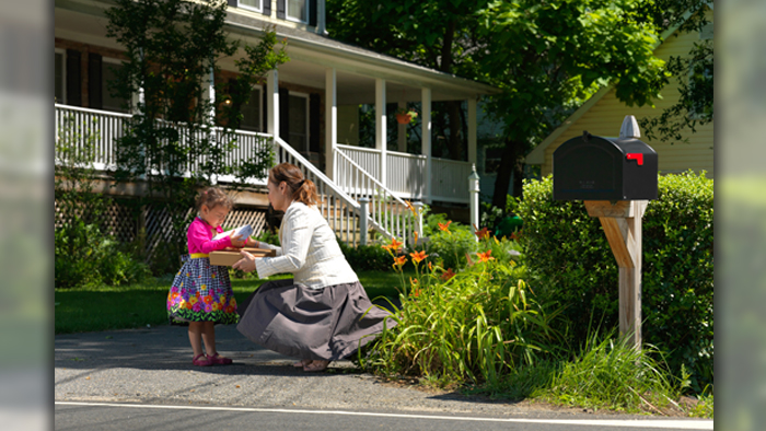 Woman and child near mailbox