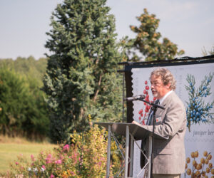 Man speaks at podium