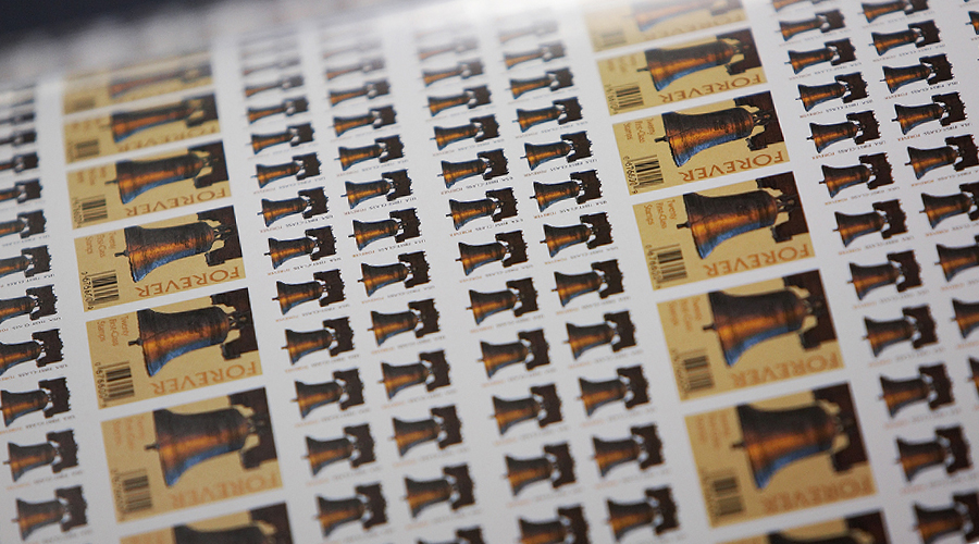 Sheets of Forever stamps being printed