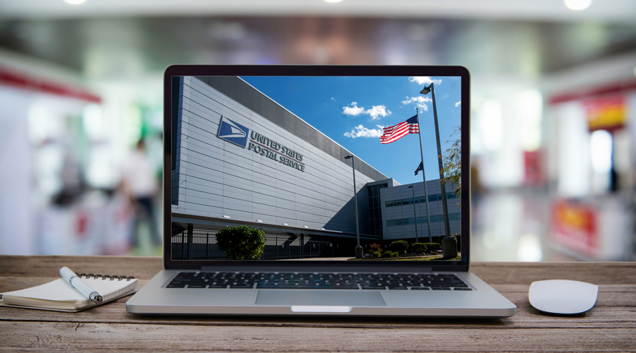 Laptop screen showing USPS facility entrance