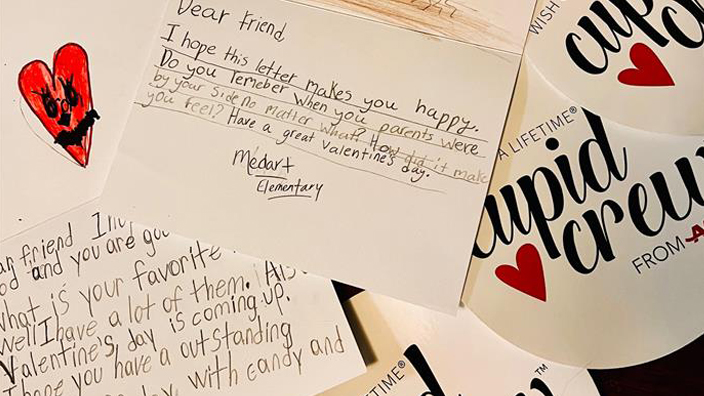 A collection of cards and letters bearing the words Cupid Crew