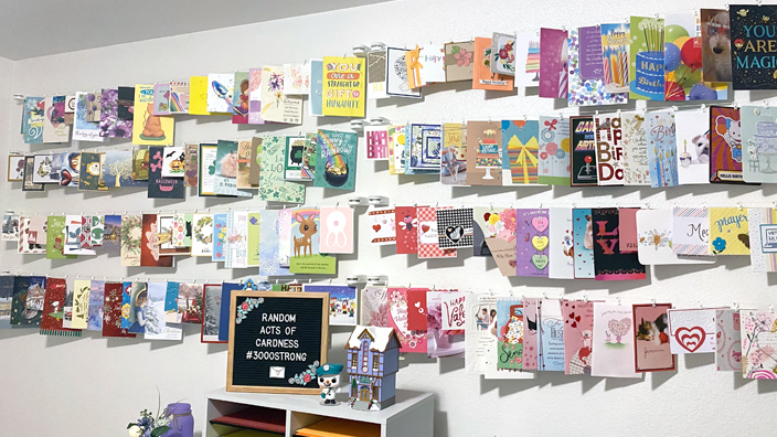 Wall with display of greeting cards